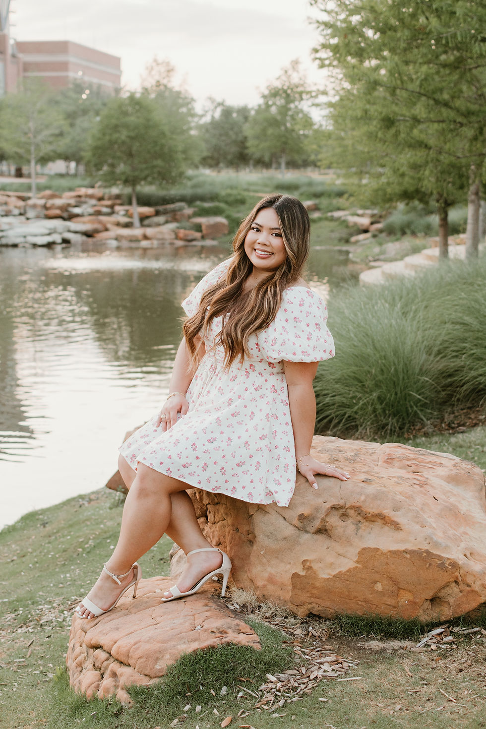 A Texas A&M senior and grad posing at Aggie Park for senior photos
