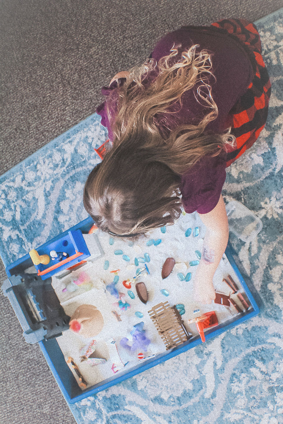 Child playing with toys in Jennifer Wisser-Stokes's East Orlando therapy office