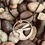 Thumbnail: Hare and the moon necklace – hand cut from penny coin with star, set on pebbles background