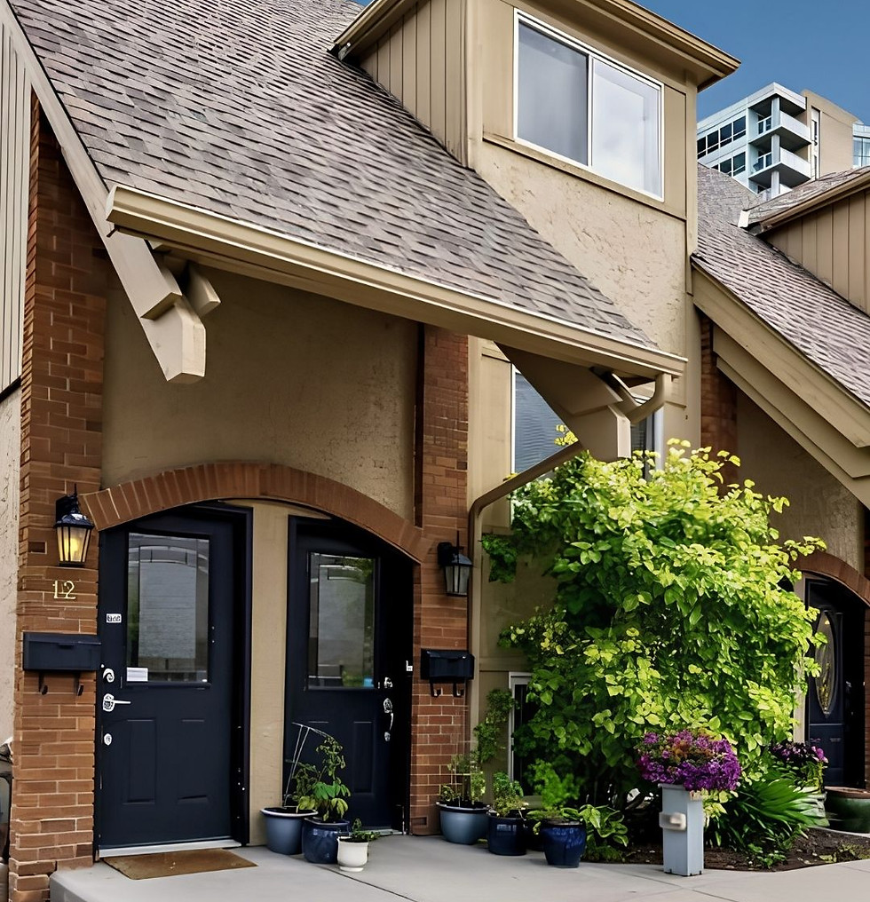Townhouse exterior with 2 black fornt doors an sloping roof with lots of flowers by entrance.