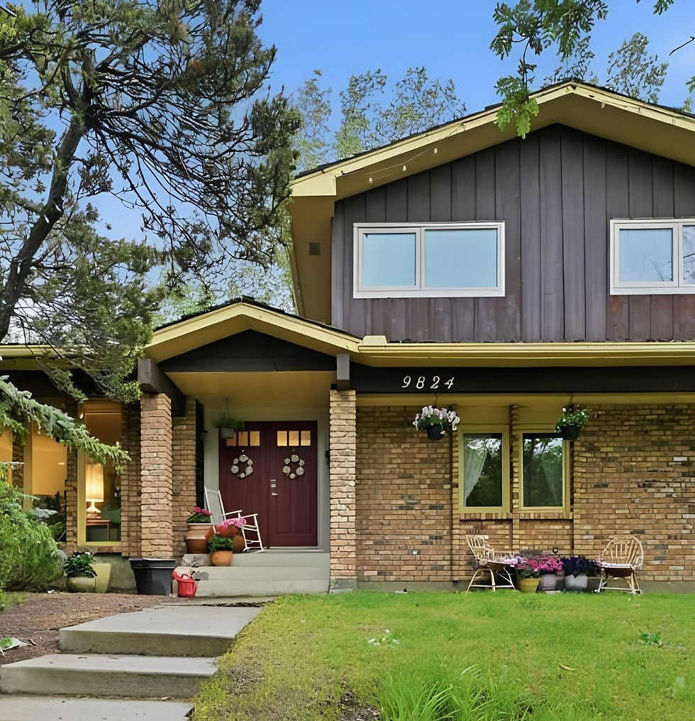 brown and yellow house with brick front and spring garden