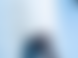 Person drawing a flowchart labeled "Tech Stack" on a whiteboard with a marker. Close-up of hand and face, blue-toned setting.