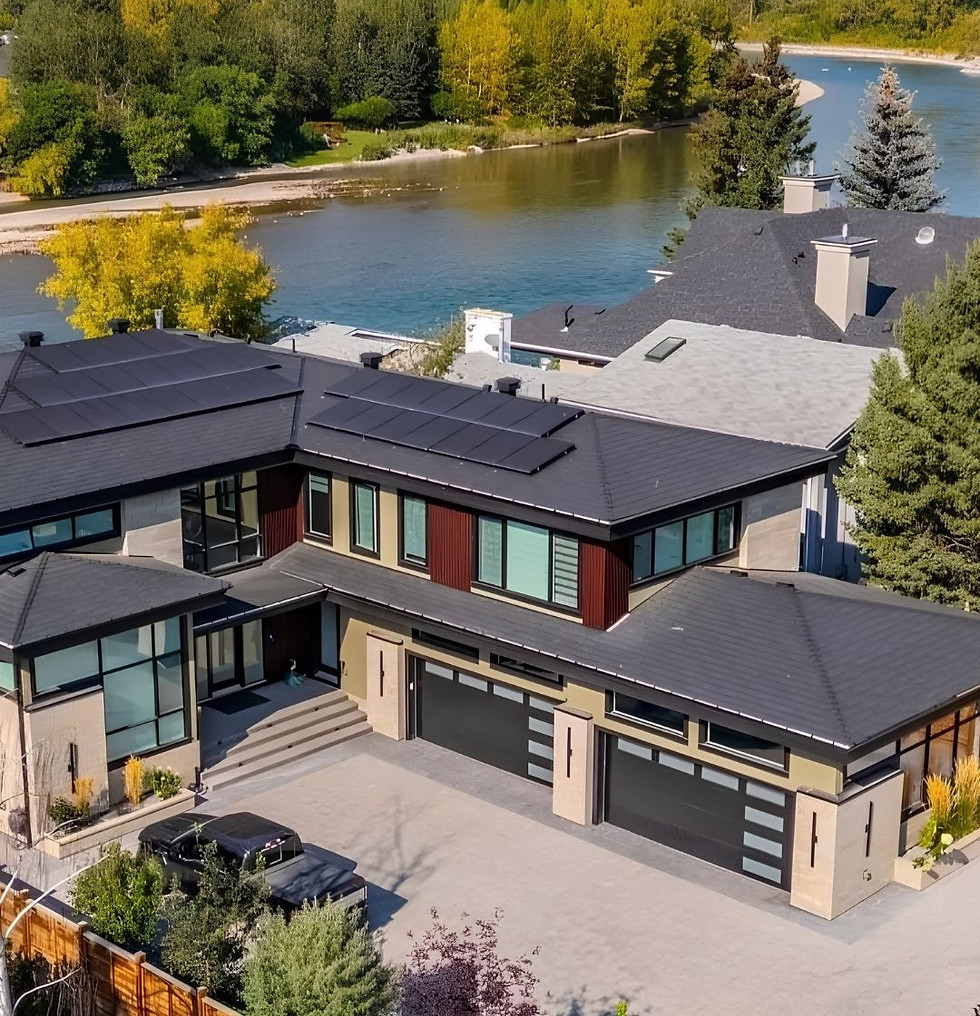Large luxury house with 2 double car garages and backing onto the Bow River with very pretty views by the bend.