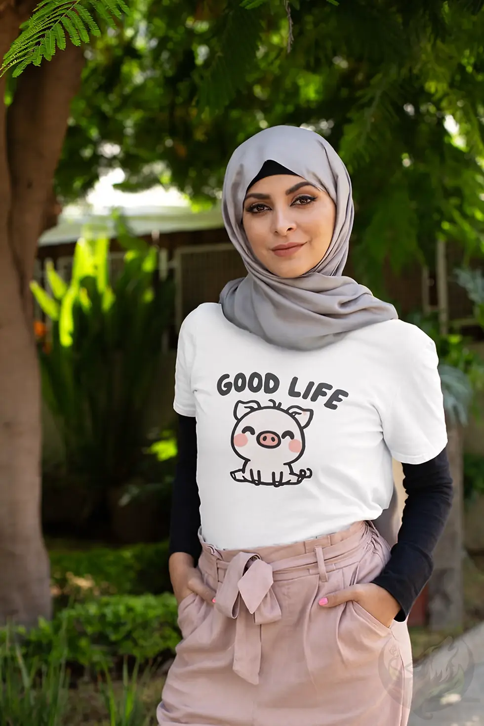 Thumbnail: Person outdoors wearing white tee with pig graphic and “GOOD LIFE”.