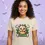 Thumbnail: Sand fitted tee with the Vegan Quotes “Chicken Vegan” design shown in a Halloween‑themed studio setting.