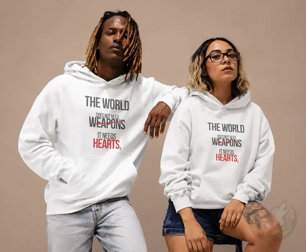 Two models wearing white unisex hoodies with The World Doesn't Need Weapons It Needs Hearts design