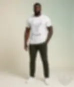 White unisex t-shirt worn by smiling man with beard and tattoos, geometric deer "Wild and Free".
