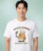 White unisex t-shirt worn by smiling man, "Potato Power! Fuelled By Plants" fun potato chef graphic.