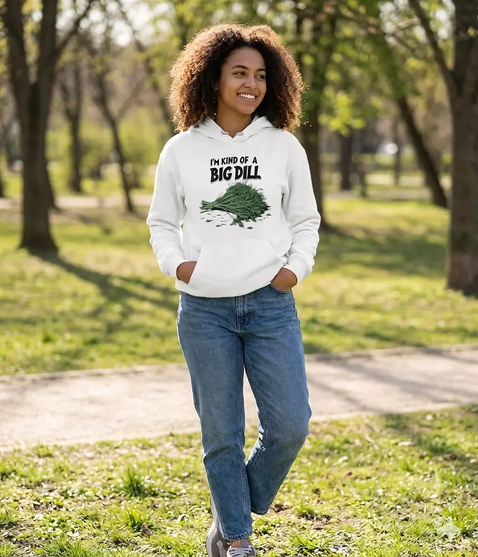 Thumbnail: Woman wearing white 'I'm Kind Of A Big Dill' funny food pun hoodie walking through a sunny park.