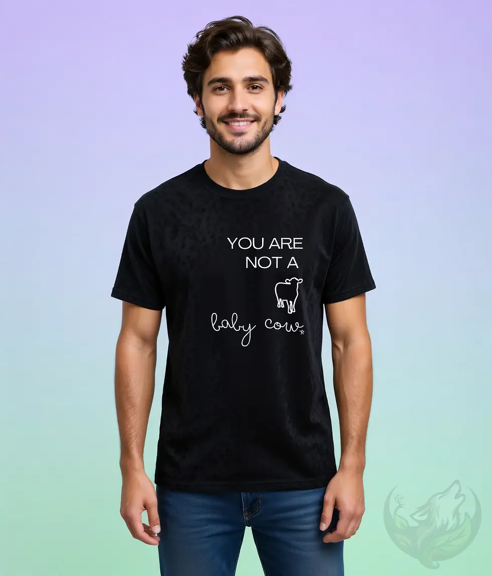 Thumbnail: Black unisex t-shirt worn by smiling man with curly hair, "You Are Not A Baby Cow" vegan design with calf graphic.