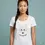 Thumbnail: Smiling woman wearing a soft white scoop neck tee with geometric fox Wild and Free design in a studio setup.