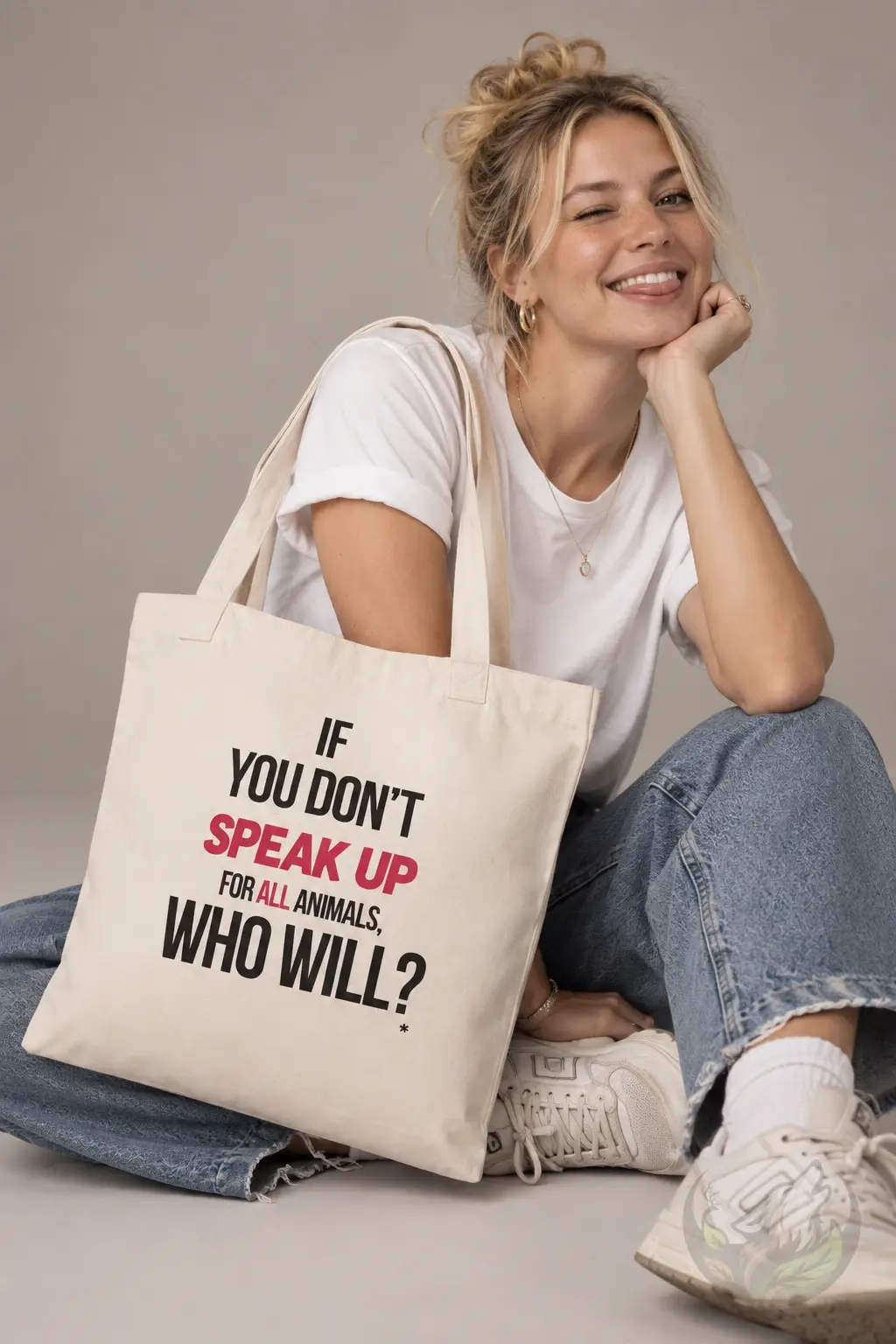 Woman carrying a natural tote bag with Speak Up for Animals vegan message
