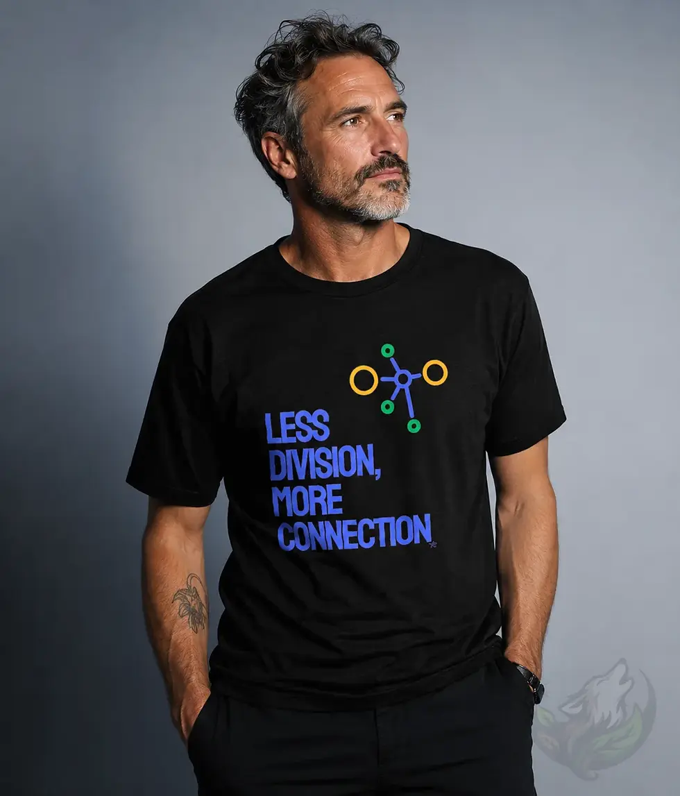Male model wearing black unisex Less Division More Connection humanity shirt in clean studio portrait