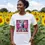 Thumbnail: White fitted tee with the Vegan Quotes “Cows Are Not Machines” design worn in a sunflower‑field setting.