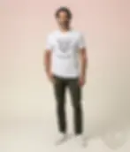 White unisex t-shirt worn by man with graying hair in studio, geometric panther "Wild and Free".