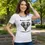 Thumbnail: White scoop‑neck tee with the Vegan Quotes “Animal Rights – A Universal Language” design worn in an outdoor park setting.