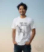 White unisex t-shirt on smiling man with black hair against blue sky, geometric wolf "Save Our Wolves" graphic.