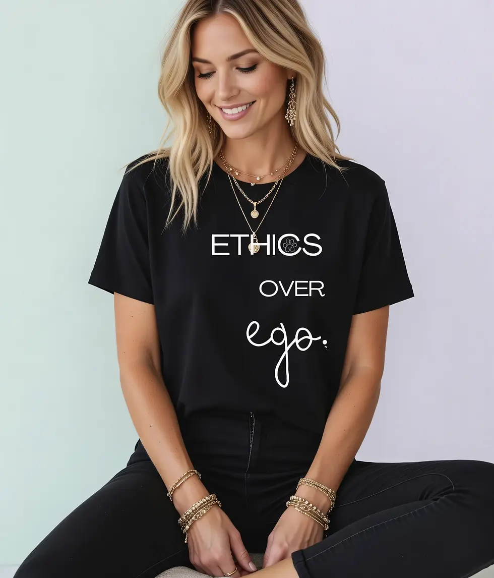 Thumbnail: Black shirt with the message “Ethics over ego” and a paw‑print O, worn with layered gold jewelry.