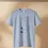 Thumbnail: Light blue shirt on a hanger with the quote “It is time to be the rational beings…” and a vertical illustration.