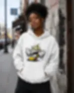 Woman wearing a white unisex hoodie featuring an angry graffiti banana design.