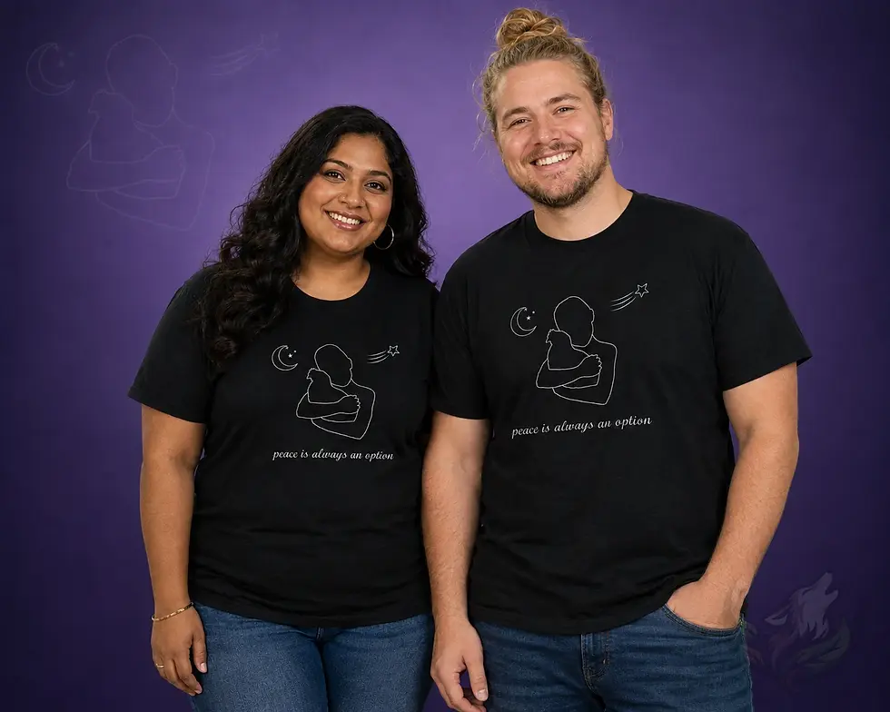Couple wearing matching black Peace Is Always An Option shirts with a white embracing figures design against a purple backgro