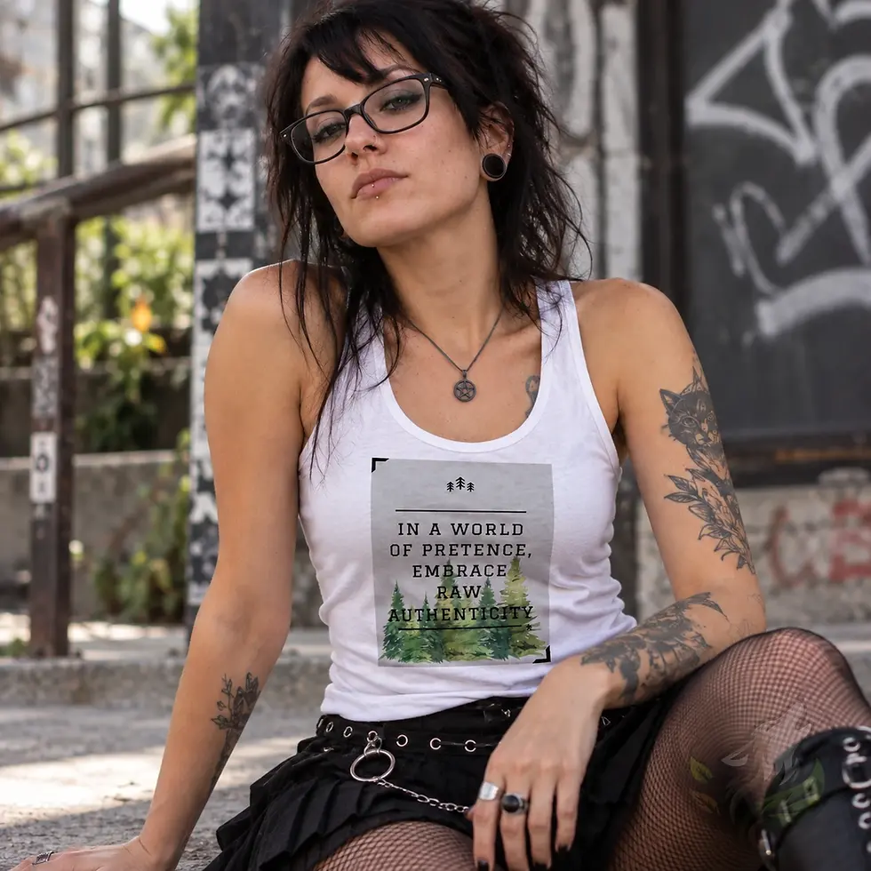 Woman wearing a white tank top with a forest design and Raw Authenticity quote in an urban setting