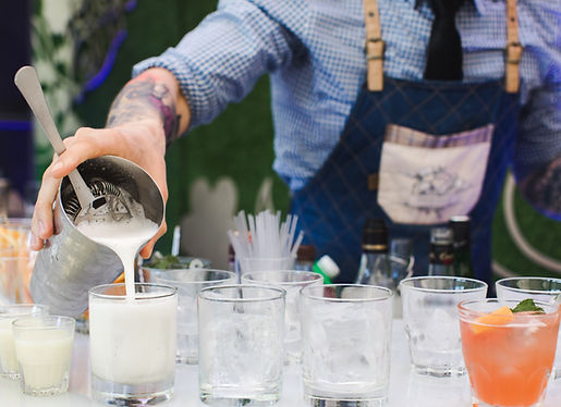 A-bartender-pouring-cocktails-at-an-event.jpeg