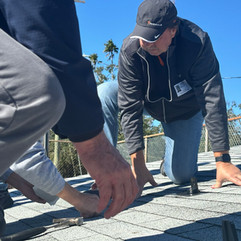 Men installing solar panels on a simulated room