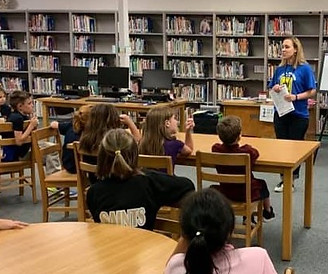 Volunteer teaching children