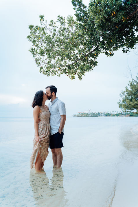 Couple sharing a quiet moment in the water at Arashi Beach Aruba, photographed by Aruba photographer Edrxck.