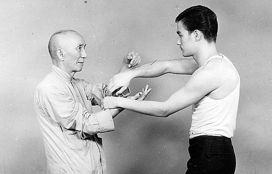 Ip Man and Bruce Lee practicing Wing Chun