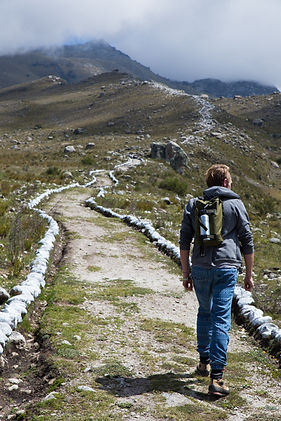 A man climbing a mountain in beautiful nature