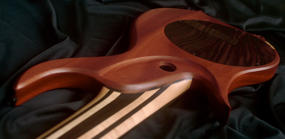 African mahogany; blackwood cavity covers.