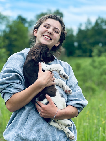 Leah with a springer spaniel puppy