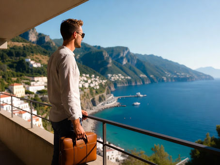Traveler with a leather briefcase on a balcony overlooking the Amalfi Coast, preparing a birth certificate apostille for dual citizenship