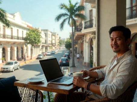 Remote worker with a laptop and coffee at a sunny cafe representing employment verification letters for apostille
