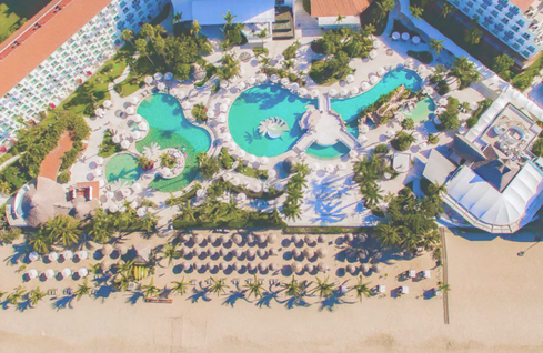 Aerial view of the Hard Rock Vallarta with the pools and beach showing where Camp VACAYA will be