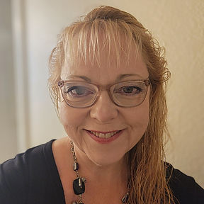 Casual Straight-on headshot edited 2025.jpg