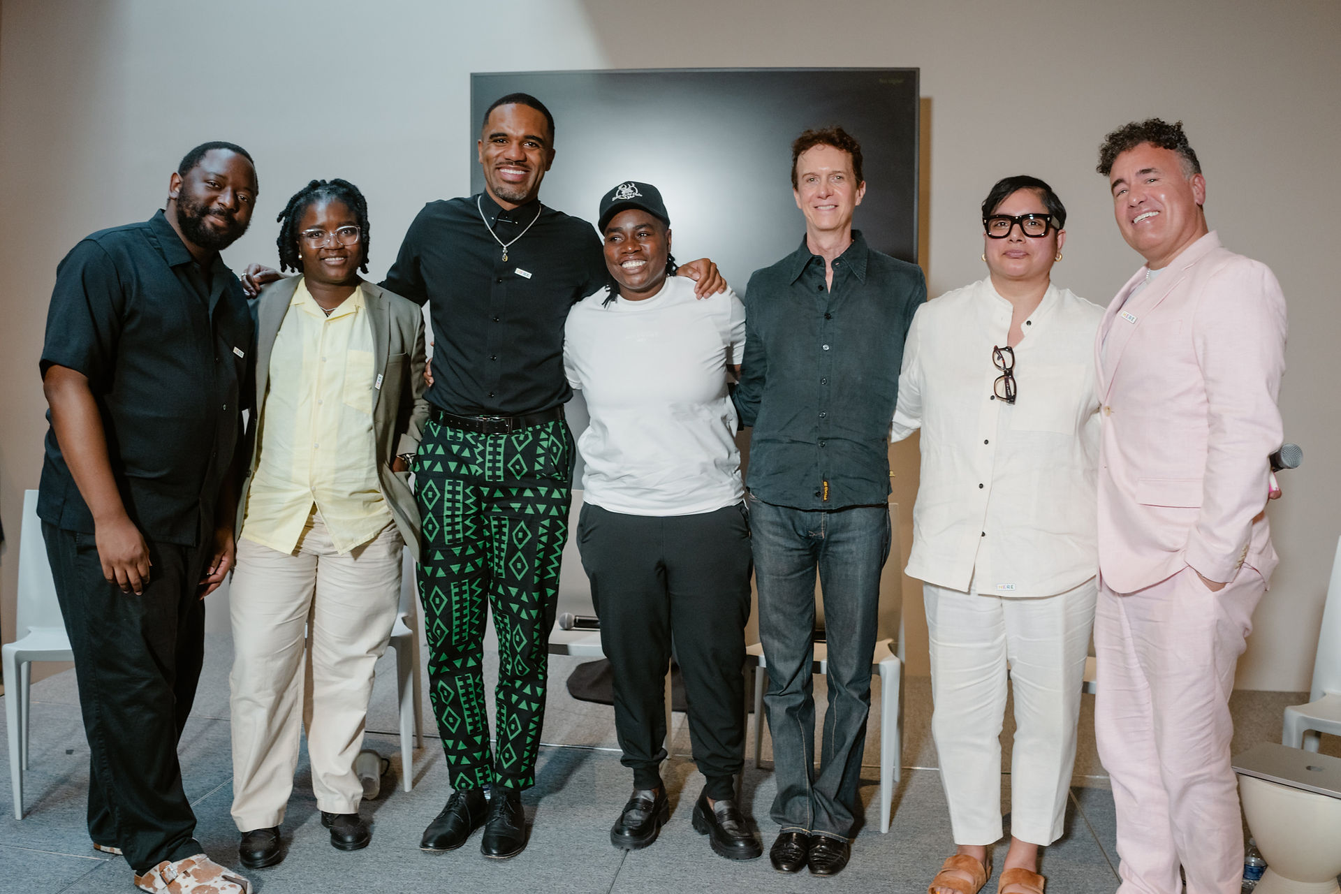 Artists, curators, and a moderator take part in a panel discussion for Here: Pride and Belonging in African Art at the Smithsonian National Museum of African Art.