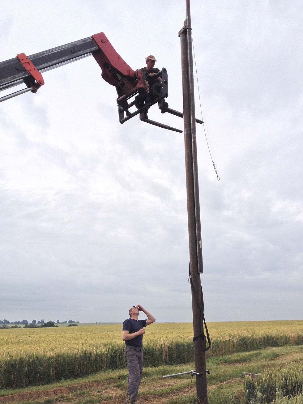 Steel support pole being lifted into position during the installation of Paul Emmanuel’s The Lost Men France, Thiepval, France, 2014.