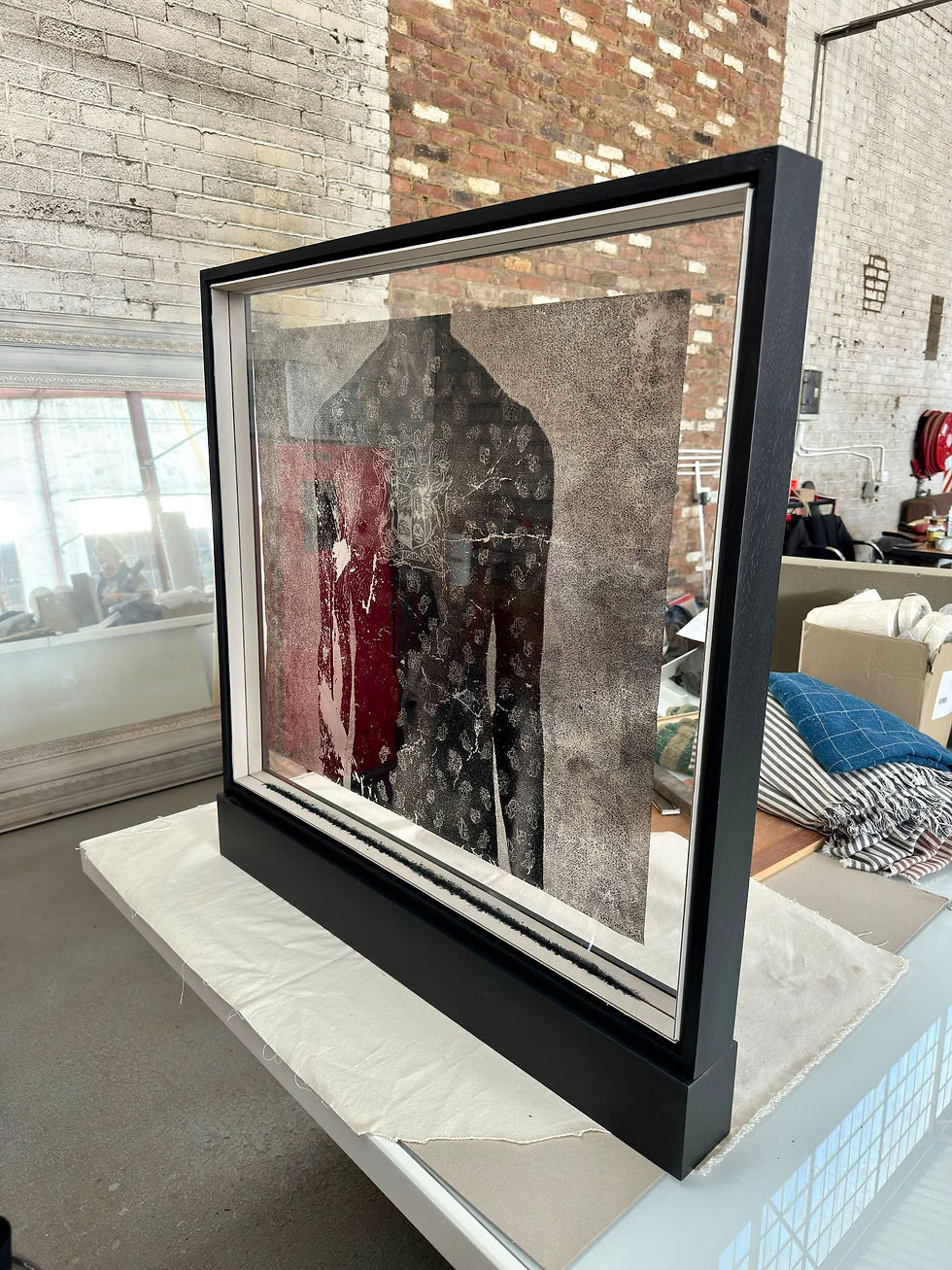 Side view of Paul Emmanuel’s Ex Unitate Vires in its new frame case at the framer’s studio in Johannesburg.