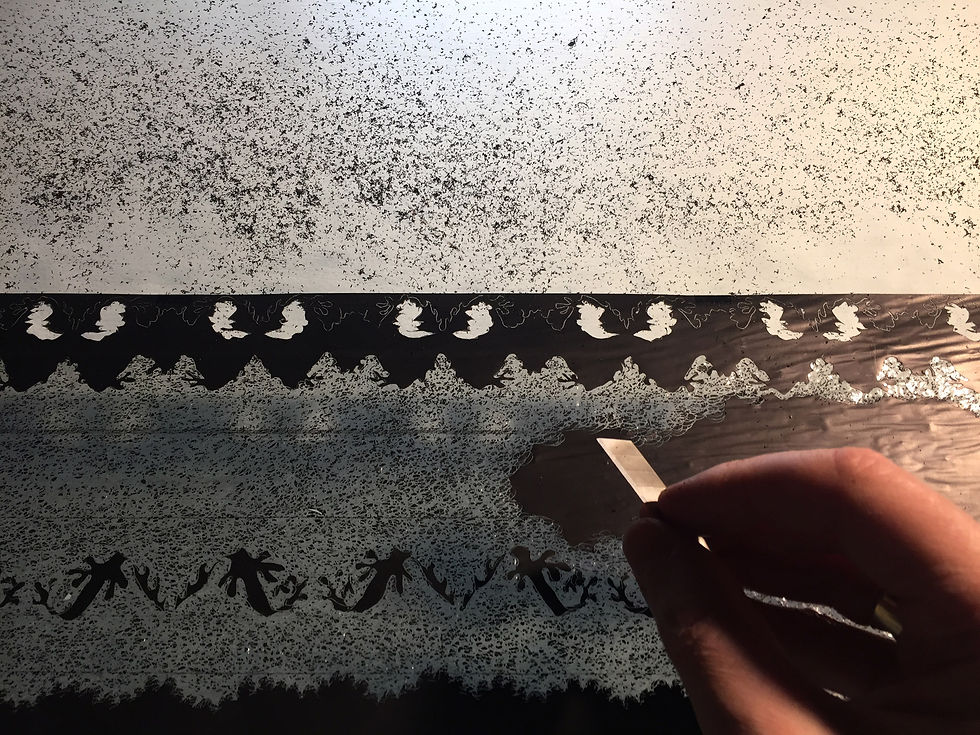 Paul Emmanuel hand-incising a lace-like pattern into carbon paper during the making of Rough Collar.