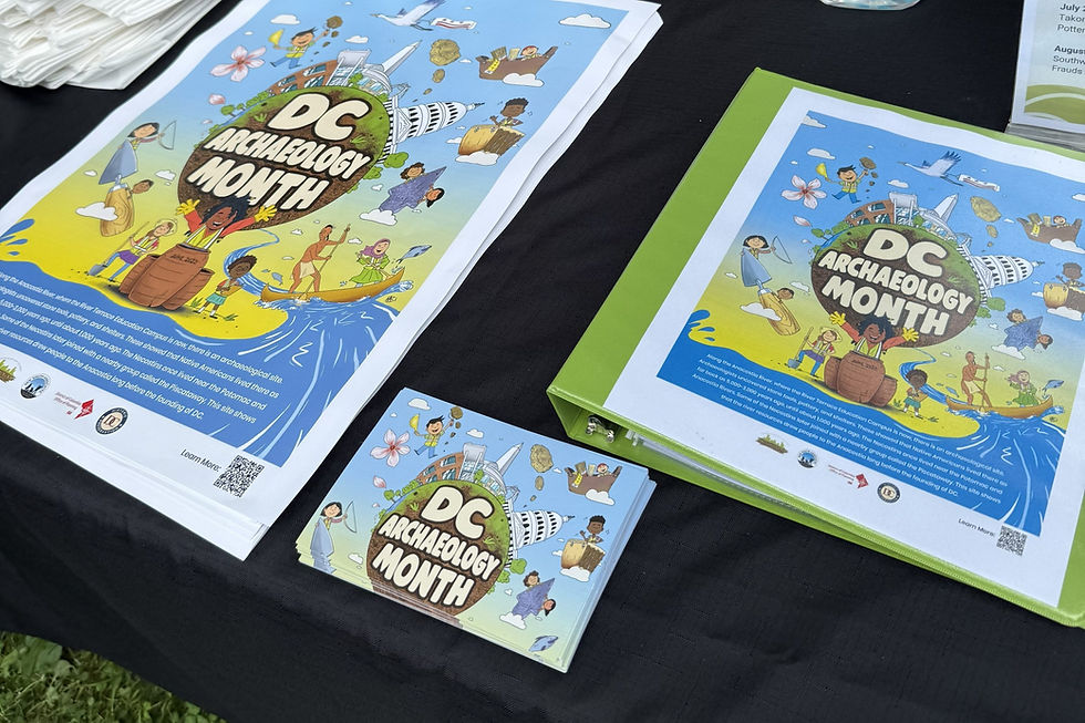 DC Archaeology Month posters and postcards displayed on a table for educational outreach.