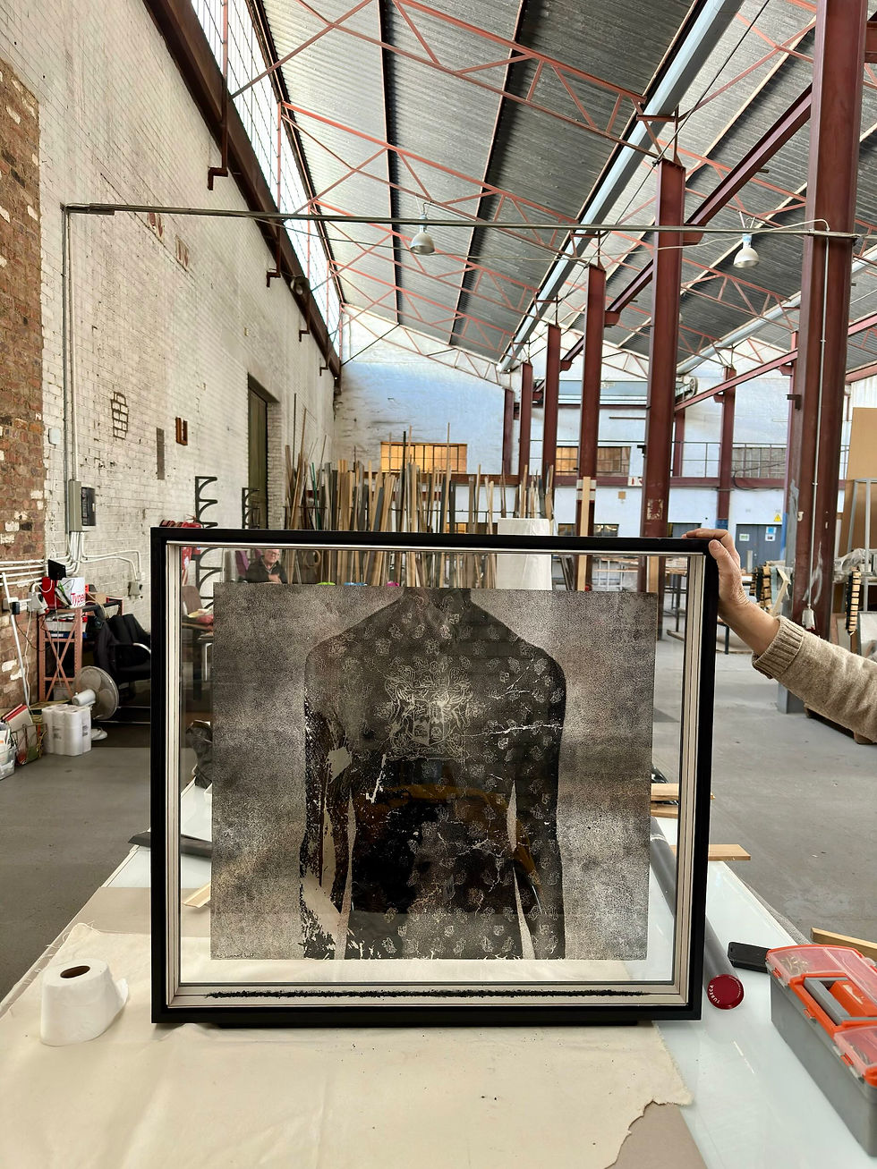 Paul Emmanuel’s artwork Ex Unitate Vires shown in its new frame case at the framer’s studio in Johannesburg.