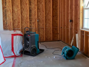 Dehumidifiers and dryers in water damaged room