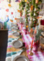 Hanging moss over holiday table set up with pink runner and floral wallpaper