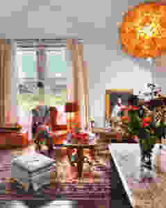 Globe light glowing with living room in background