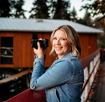 Chris Karpiak holds her camera. She loves photography.