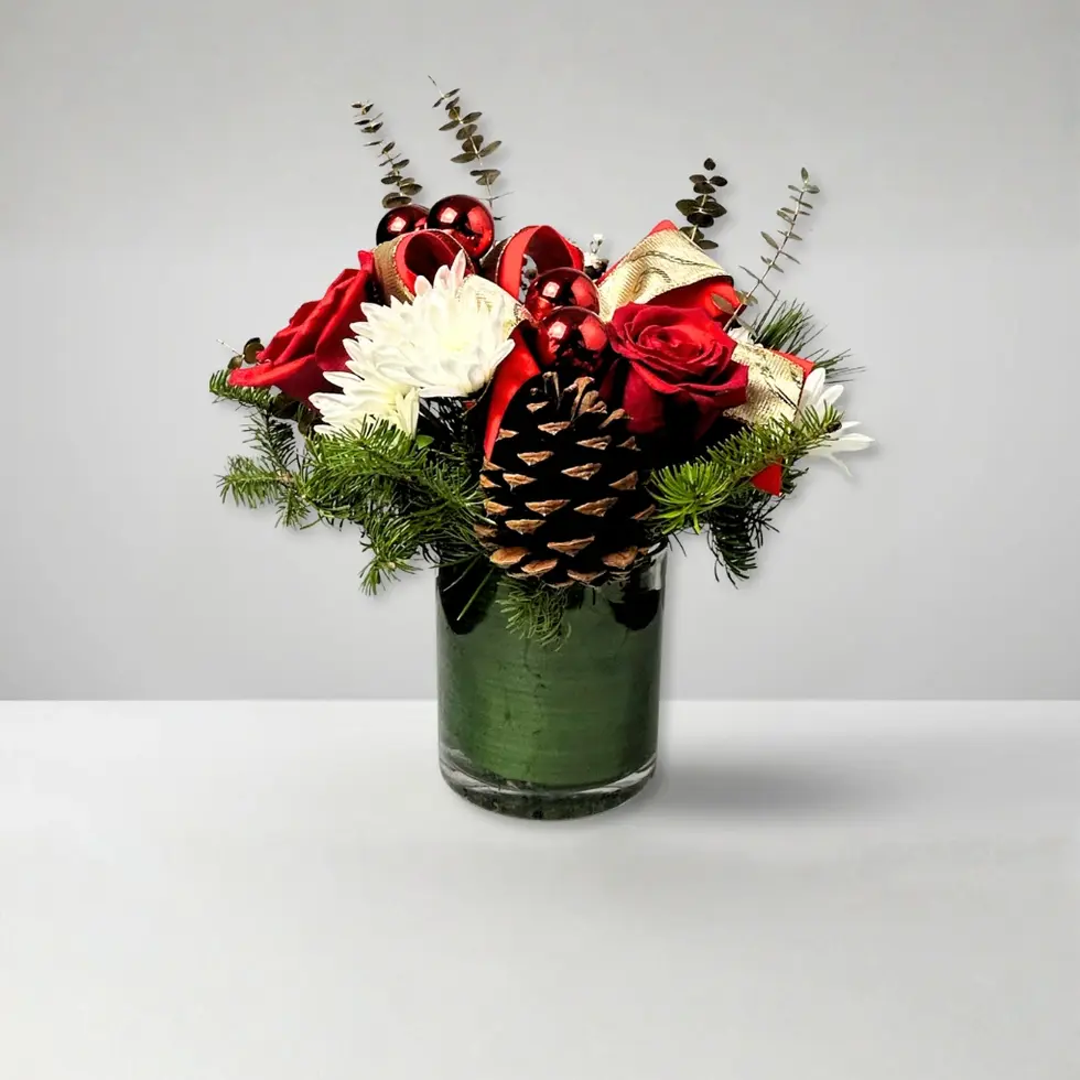 Christmas vase arrangement with red roses, gold ribbon, ornaments, pinecones, and holiday greenery in Oceanside.