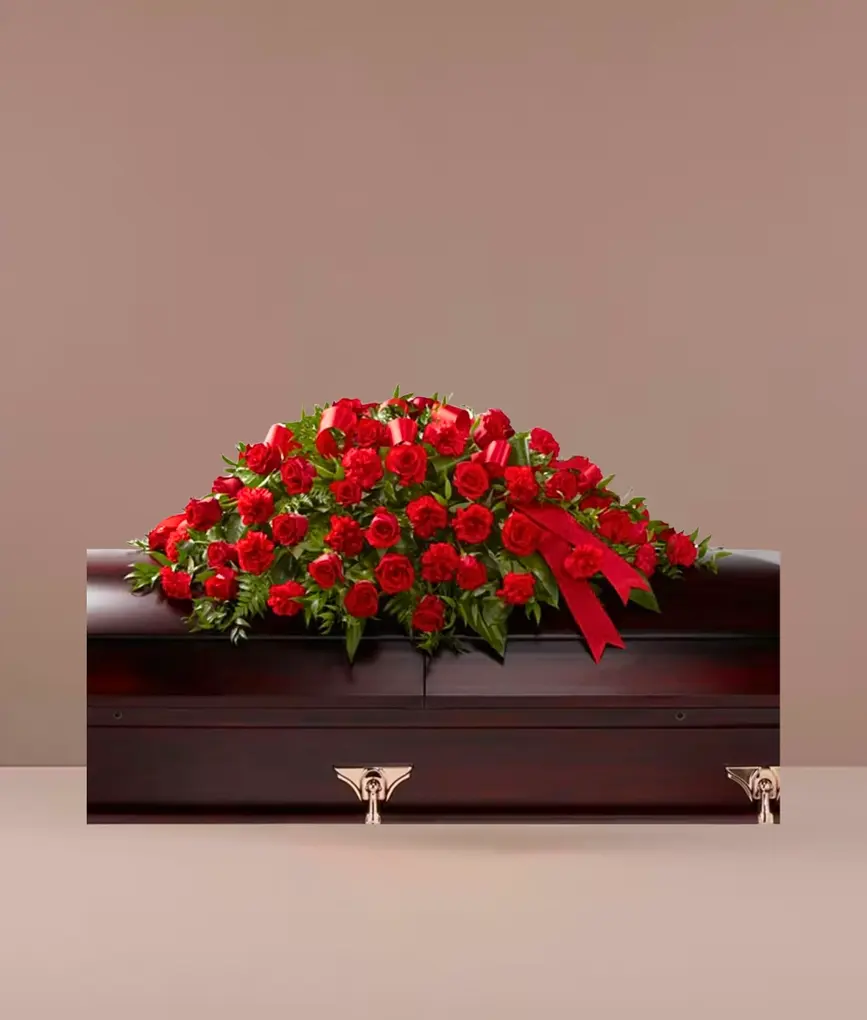 Care and Compassion casket spray with red roses – East Rockaway NY funeral florist